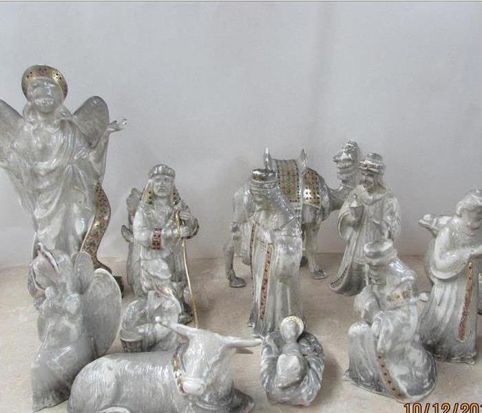 nativity set covered in soot