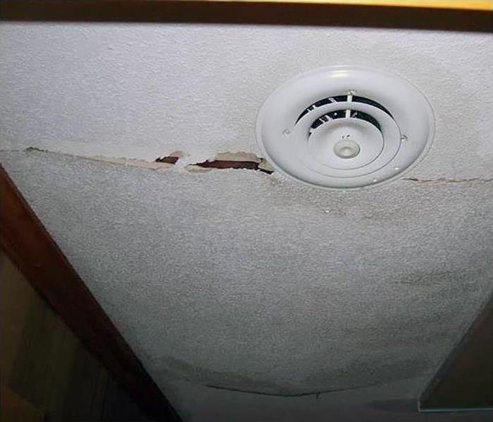 Ceiling damaged after storms cause heavy water damage